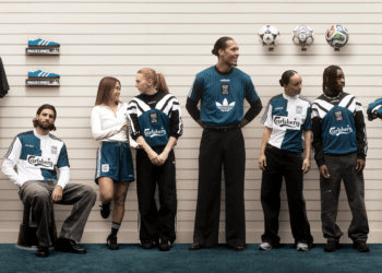 To mark the launch, LFC and adidas are releasing a 3-part campaign film inspired by the golden era of 90s football culture. Set inside a retro sports store named Fowler’s Sports, the campaign stars club legends Robbie Fowler and Steve McManaman alongside players from past and present – including Virgil van Dijk, Jeremie Frimpong, Florian Wirtz, Mia Enderby and Grace Fisk. It brings together different eras of the club in a nostalgic tribute to a time when football kits became cultural icons beyond the pitch. All three episodes will be available today on LFC’s YouTube channel. At the heart of the Bringback range is a reissue of the club’s iconic 1995/96 away shirt, reconnecting supporters with one of the most recognisable designs in the club’s history. The collection is supported by a full archive-inspired training wear offering, including classic silhouettes such as shorts, a sweatshirt, drill top, drill pants and T-shirt. Each piece returns in the unmistakable green, black and white colour palette synonymous with the era, while heritage details including the original Liverpool FC crest from the 1995/96 season, Carlsberg sponsor and bold adidas branding complete the authentic 90s aesthetic. Alongside the original design, the range also introduces a contemporary blackout version of the hero jersey, featuring a tonal crest, sponsor and adidas branding for a modern reinterpretation of the classic look. This is a limited-edition product available online and in select official club stores – Liverpool ONE, Anfield and Williamson Square in Liverpool and Ilac and Sword Pavilions in Ireland. To celebrate the launch, the Liverpool ONE and Anfield stores will have DJ's Nay Maxwell and Mo Stewart playing 90's anthems on Friday March 13 between 10-4pm. The first 100 people to buy something from the new collection will receive a free Fowler's Sports carrier bag with their purchase. The full range is available to purchase now via our online store, in official LFC stores (UK and internationally) and via the LFC Store app. Season Ticket Holders, All Red Full, Light and Junior members will receive a 10 per cent discount. Worldwide shipping is available via UPS. Spend over £80 ($100) to get free delivery in the UK and selected countries.