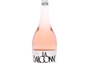 Dame Joan Collins kicks off rosé season with pink carpet moment at M&S
